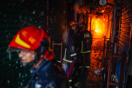 Firefighters and local people try to extinguish a fire that broke out in Bangabazar Market in Dhaka. The fire that took place in Dhaka's Bangabazar Market early on Tuesday, was brought under control after over six hours of frantic efforts. At least 48 units of the Fire Service and Civil Defence were working to douse the blaze. Businessmen expressed their grief and helplessness as they are at a great loss. Some of the businessmen stock more clothes ahead of Eid. Hence, some lost more than a million taka. Around 3,000 shops are operating in Bangabazar Market.