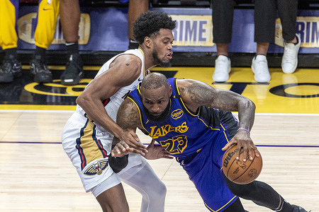Los Angeles Lakers' LeBron James #23 drives against New Orleans Pelicans' Keion Brooks Jr. #0 during an NBA basketball game at Crypto.com Arena on Friday, April 4, 2025 in Los Angeles.