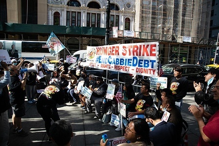 Protesters seen with placards expressing their opinion, during the strike.
Elected officials gathered with taxi drivers outside City Hall to announce the beginning of a hunger strike following a month-long 24/7 protest calling on Mayor Bill de Blasio to provide relief from medallion debt that has taken many drivers’ lives.