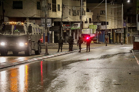 Israeli soldiers aim the laser sight of their rifles at journalists while providing protection for Jewish worshippers praying near Joseph's Tomb, east of Nablus in the West Bank. Residents reported that an Israeli military jeep ran over a 20-year-old man during raids and the eviction of residents from their homes to use them as guard posts. An Israeli soldier was also injured when he was struck by stones thrown by Palestinian protesters while on guard duty.