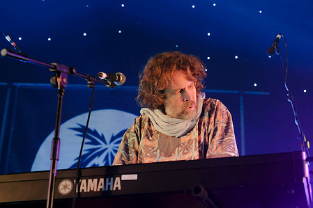 Irish singer, songwriter, actor and musician, Liam O' Maonlai best known as the lead vocalist with Dublin band The Hothouse Flowers, playing keyboard while performing live on stage at Wickham Festival.