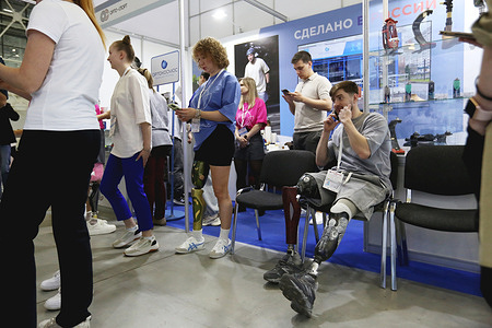 A visitor consults with staff at the Russian Orto Sport Group vendor booth during 10th International Exhibition of Equipment and Technology for Rehabilitation and Care Intergration Moscow is an international specialized exhibition of innovative technologies for social adaptation and rehabilitation of people with disabilities, limited health and developmental disabilities. Event brings together more than 4000 visitors, 7 countries and 144 exhibitors