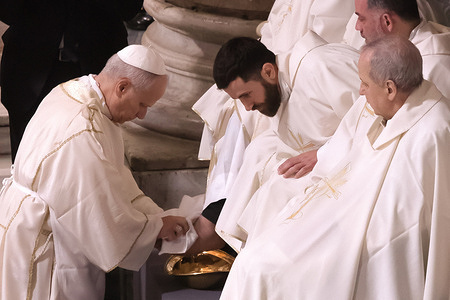 Pope Leo XIV washes the feet of priests during the Mass of the Lordís Supper on Holy Thursday at the Papal Basilica of St. John Lateran in Rome.