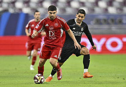 Marwan Sherif (L) of Al-Arabi SC and Roberto Firmino (R) of Al-Sadd SC seen in action during the Qatar Stars League match between Al-Arabi SC and Al-Sadd SC at Khalifa International Stadium. Final score Al Sadd SC 1 : 2 Al-Arabi SC.