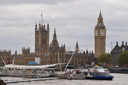 General view of the Houses of Parliament, Big Ben, and River Thames in London.