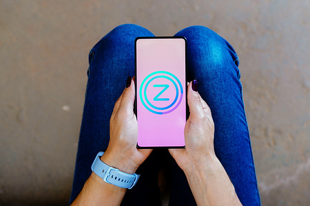 In this photo illustration, the Zoox Smart Data logo is displayed on a smartphone screen.