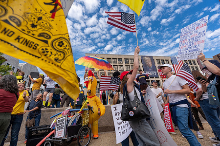 People participate in a No Kings demonstration near the National Mall, Saturday, Oct. 18, 2025, in Washington. The No Kings Day protests took place around the country and internationally to protest President Donald Trump's policies.