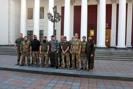 Veterans and active duty servicemen of Marine Corps of the Naval Forces of the Armed Forces seen posing for a photo on Birzheva Square. On the occasion of Marine Corps Day, the flag of these military formations was raised on Birzheva Square.
Marine Corps Day is a professional holiday of marines of the Naval Forces of the Armed Forces of Ukraine, celebrated every year on May 23.