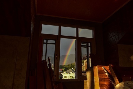 A rainbow is seen over the residential houses in Srinagar, the summer capital of Jammu and Kashmir.