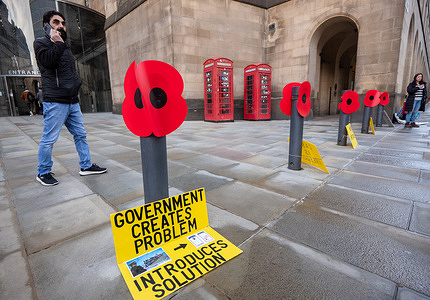 Anti Digital ID placards have been tied to posts used to display poppies for remembrance day at St Peter's square in Manchester. The British government is proposing introducing a digital ID scheme. Digital ID will be made available to all UK citizens and legal residents but will only be mandatory for employment, under the government's proposals.