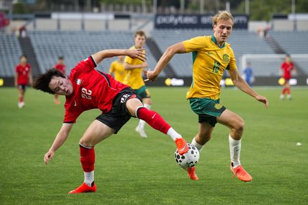 Lee Taegyeong (L) of Korea Republic football team and Nathan Barrie (R) of Australia football team seen in action during the U23 International Friendlies match between Australia and Korea Republic held at polytec Stadium. Final score; Australia 1:2 Korea Republic.