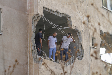 Palestinians inspect the house of the Palestinian gunman Raad Khazem after it was demolished by the Israeli army in the city of Jenin in the occupied West Bank. Palestinian Raad Khazem, was a perpetrator of a shooting attack on Jewish settlers in the Israeli city of Tel Aviv.
