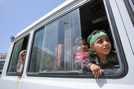 A Palestinian boy looks out of a bus window after he participates in a rally marking the 74th anniversary of Nakba, in front of the UNESCO offices in Gaza City. Palestinian factions organise a rally every 15th. of May marking what they call the "Nakba," or "catastrophe" referring to their uprooting in the war over Israel's 1948 creation.