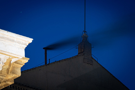 Black smoke billows from the chimney of the Sistine Chapel during the cardinals' conclave to elect a new pope.