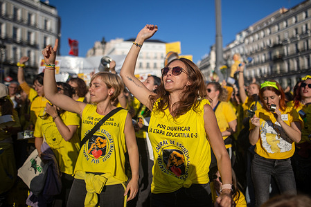 Protesters wearing yellow t-shirts march during the demonstration. Early childhood educators (ages 0-3) held a demonstration in Madrid. These educators are mobilizing across Spain in over 53 demonstrations and a general strike, demanding recognition of their profession and recognition of early childhood education as a legitimate educational stage, because "we are not daycare centers."