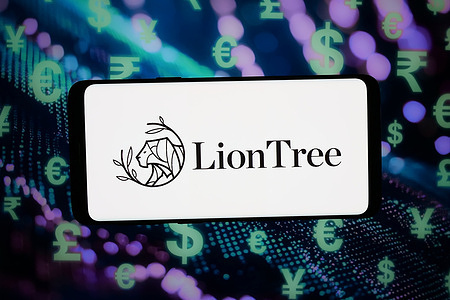 In this photo illustration, the logo of US financial services company LionTree LLC is displayed on a smartphone in front of abstract background on computer screen.