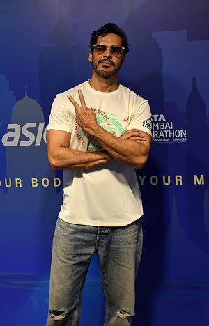 Former supermodel and Bollywood actor Dino Morea poses for a photo at the ASCIS merchandise launch for Tata Mumbai Marathon (TMM) 2026 at the store in Mumbai.