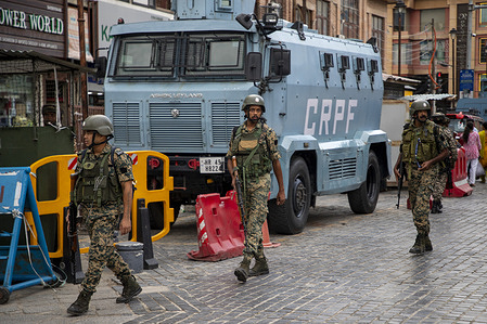 Indian security personnel patrol along a road in Srinagar, the summer capital of Jammu and Kashmir. Security has been increased in the region ahead of India's Independence Day celebrations. India will mark its 80th Independence Day on August 15, commemorating the country's independence from British rule on August 15, 1947.