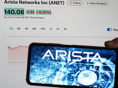 In this photo illustration, the Arista Networks Inc. logo is displayed on a smartphone screen.