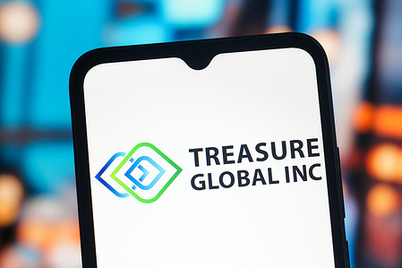 In this photo illustration, the Treasure Global logo is seen displayed on a smartphone screen.