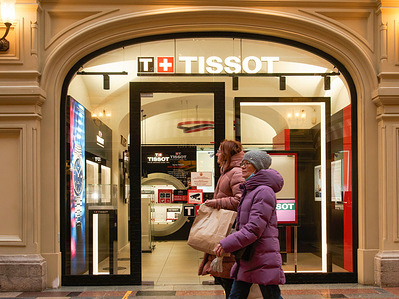 Shoppers walk past a closed Tissot boutique. 
Major international premium brands have ceased their activities in Russia, by closing their stores.