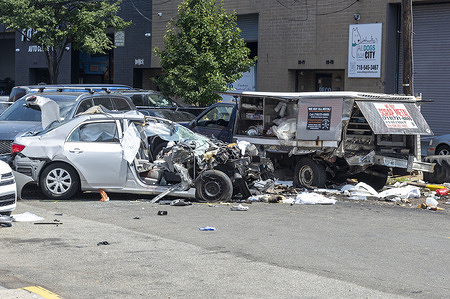 The damaged Toyota Corolla and coffee truck are seen at the scene of the crash were the driver and two pedestrians died in the Astoria neighborhood in the Queens borough of New York City. The crash happened on 19th Avenue and 42nd Street just after 8:30 a.m. The 84-year-old driver of a Toyota Corolla, who has not been identified, was taken to Elmhurst Hospital where he was pronounced dead. Investigators say two male pedestrians standing by the coffee truck, ages 41 and 70, were standing by the coffee truck and were struck. The 41-year-old was pronounced dead at the scene and the 70-year-old was taken to the hospital where he was pronounced dead.