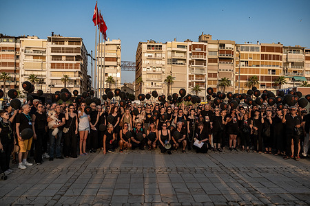 Animal rights activists seen posing for a photo after the march. Animal rights advocates held a silent march in Izmir, Turkey, calling for the protection of stray animals and their right to life. Participants urged authorities to adopt humane and permanent solutions for stray animals and encouraged the public to adopt animals from shelters or the streets.
