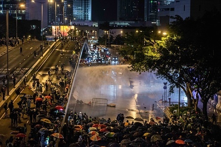 Hong Kong police disperse protesters using water cannon jets during the demonstration.
Demonstrations continue in Hong Kong in another night of protests during the commemoration of the 5th anniversary of the Umbrella Movement at Tamar Park.