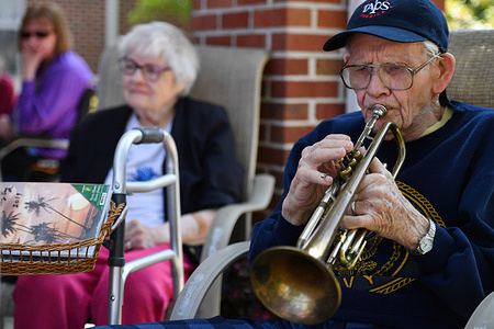 Bobby Baird, 93, plays Taps at The Garden nursing center at 3 pm on Memorial Day for Taps Across America, a National Moment of Remembrance. Baird has been participating in the annual event since its start in 2000. Bobby Baird was the youngest member of the US Navy Band when he played from 1948-52.