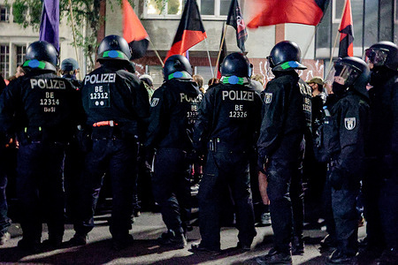 A couple kisses during the "Revolutionary May Day" demonstration in the Kreuzberg and Neukölln districts of Berlin. People took part in the rally, with protesters chanting slogans against NATO, capitalism and war, as well as expressing solidarity with Palestine and several other countries. According to authorities, around 50,000 people participated in May Day events across Berlin, including about 10,000 in the evening march. Police deployed roughly 5,000 officers, and no major clashes were reported. Traffic restrictions were introduced in several areas, and some metro stations were temporarily closed due to large crowds.