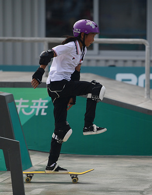 Chenxi Cui of China is seen in action during the 19th Asian Games Skateboarding Women's Street Final held at the Qiantang Roller Sports Centre in Hangzhou. Cui scored 242.62 .