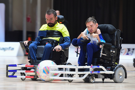 Erwan Conq (L) of the France powerchair football team and Marcus Harrison (R) of the England powerchair football team seen in action during the FIPFA Powerchair Football World Cup 2023 match between France and England at Quaycentre. Final score; France 2:0 England.