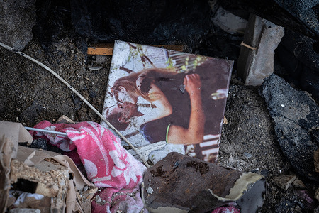 A family photo is seen on the ground of an apartment building destroyed in a overnight air strike. Emergency crews are seen extinguishing fires, searching for survivors beneath the rubble, and assessing the destruction. Scenes show bloodstains on the ground and personal belongings scattered amid the debris. At least 15 people were killed in the Russian airstrikes, and the death toll may rise, though the exact number has not yet been confirmed.