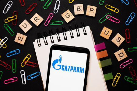 In this photo illustration, a Gazprom logo seen displayed on a smartphone.