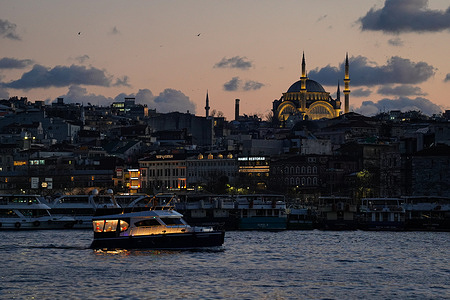 A vessel sails along the Bosphorus Strait as the Ottoman Al-Noor Mosque appears in the background.