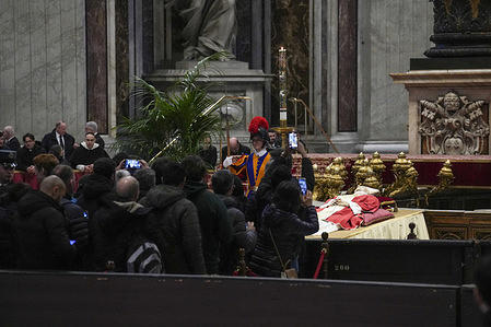 (EDITORS NOTE: Image depicts death)
Mourners take photographs of the body of Pope Emeritus Benedict XVI as it lies in state inside St. Peter's Basilica. The Vatican announced that Pope Benedict died on December 31, 2022, aged 95, and his funeral will be held on January 5, 2023.