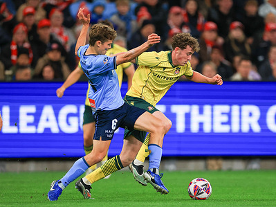 (L-R) Corey Hollman of Sydney FC and Harry Ashfield of Wrexham AFC is seen in action during the match between Wrexham AFC and Sydney FC at Allianz stadium. Final score; Sydney FC 2 : 1 Wrexham AFC.
