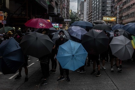 Protesters occupy the street during the demonstration.
Protesters went out to demonstrate against the Anti-mask Law. Hong Kong's chief executive Carrie Lam invoked the use of the Emergency Regulations Ordinance (ERO) allowing the government to ban use of masks in public gatherings.