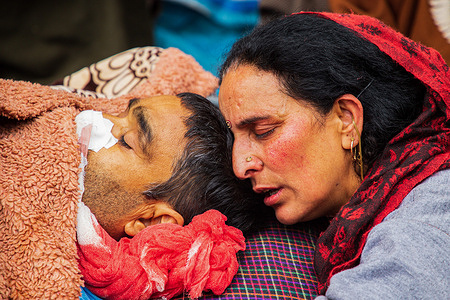 (EDITOR'S NOTE: Image depicts death)
A relative mourns near the dead body of Sanjay Sharma, a Kashmiri Hindu bank security guard who was shot dead by suspected militants in Pulwama South of Indian-administered Kashmir. Police said suspected militants opened fire on Sanjay Sharma while he was going to a local market in Achan village Pulwama district.