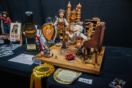 An ornate cake is displayed after winning one of the Grand Prix awards. The Sweet Expo trade fair takes place at Warsaw's EXPO XXI exhibition centre. EXPO Sweet is a vibrant international trade fair where pastry chefs, chocolatiers, and dessert professionals showcase their wares.