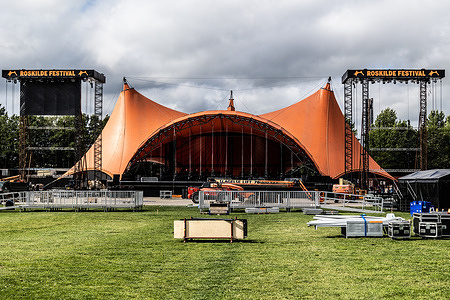 The Orange Stage is being prepared for the Roskilde Festival. The festival is the largest of its kind in the Nordics, with an expected 130.000 participants creating Denmark’s fourth largest “city” during the 7 days the festival spans. The camping area opens four days before the festival, with music playing 2 July-5 July.