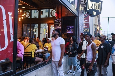 Basketball fans watch Game 3 of the NBA Finals at a bar near Gainbridge Fieldhouse as a protest takes place nearby opposing recent ICE immigration raids. A peaceful protest took place near Gainbridge Fieldhouse opposing recent ICE immigration raids, as police maintained a visible presence. Demonstrators voiced concerns over family separations, lack of due process, and the humanitarian and economic impact on immigrant communities. Many also criticized the aggressive tactics and racial profiling associated with such raids, calling for reforms or even the abolition of ICE.