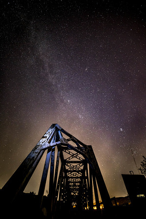 The Milky Way, part of our galaxy photographed with long exposure technique over an abandoned rail bridge near the Philadelphia village between Thessaloniki and Kilkis cities in Greece.