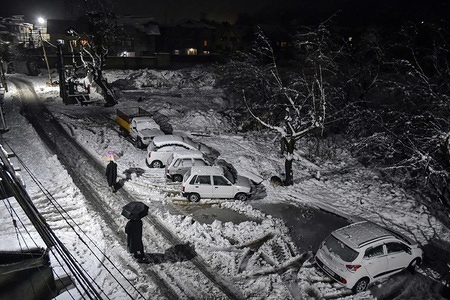Residents are seen walking through a snow covered road during the fresh snowfall in Srinagar, Indian administered Kashmir.
Fresh snowfall affected life across the Kashmir valley. The National Highway remained closed for the second consecutive day and flight services to and from Srinagar were cancelled.
The weather man has forecast improvement in weather conditions from Feb 8.
