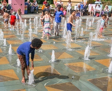 A kid plays at a fountain during a warm day at the Peace Gardens in Sheffield.
After heavy rainfall during the weekend the temperatures rose to 24 Celsius.