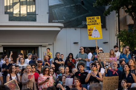 Protesters hold placards during the demonstration. Hundreds of demonstrators gathered in Porto for a Palestine solidarity march calling for an end to the war in Gaza and support for Palestinian rights. The march began at Praça dos Poveiros and concluded at Praça D. João I.