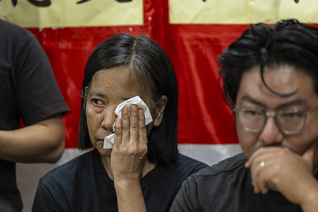 Chan Po Ying, chairperson of the Hong Kong's pro-democracy political party wipes her tears at the press conference during the disbandment. The Hong Kong pro-democracy party League of Social Democrats with nearly 20 years of history announced its dissolution today due to immense political pressure.