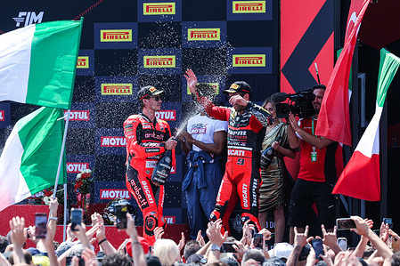 (L) Nicolo Bulega of Aruba.it Racing - Ducati with Ducati Panigale V4R celebrate the second place in Race 1 during FIM SBK Superbike World Championship Pirelli Emilia-Romagna Round 6 - Podium Race 1 at Misano World Circuit Marco Simoncelli.