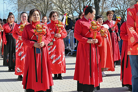 People in traditional costumes attend the Chinese New Year, the Year of the horse parade in the Usera district in Madrid.