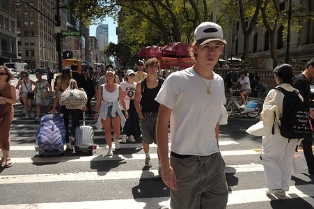 People walk on the street in Manhattan, New York City.